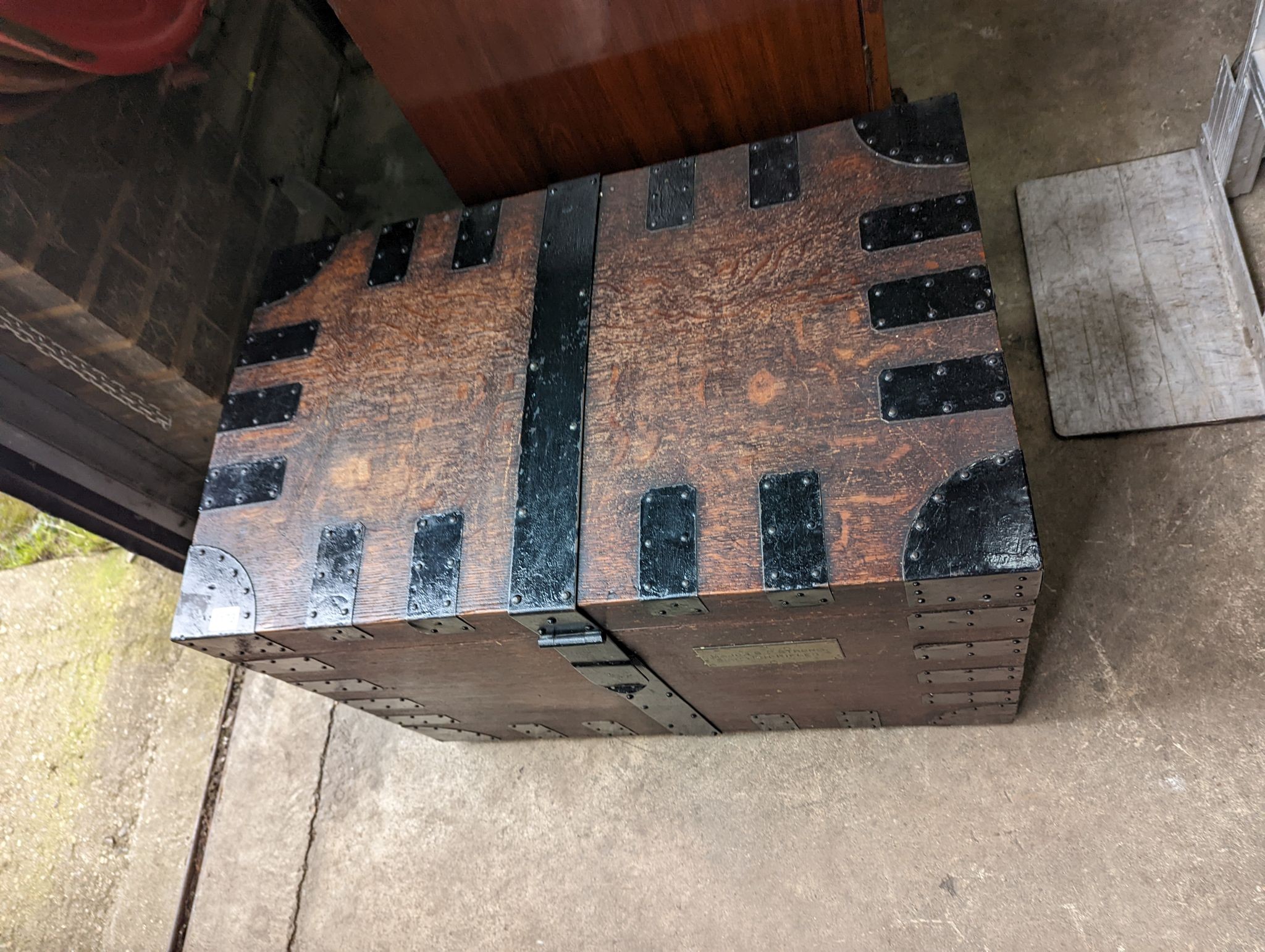 A Victorian iron bound oak silver chest, bears engraved brass plaque Major S. P. Strong, Scottish Rifles, length 82cm, depth 61cm, height 57cm